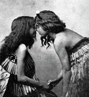 Teenager Gallery: Maori girls rubbing noses, c1920