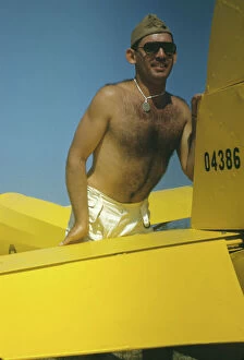 Bare Chested Gallery: Marine with the training gliders at Page Field, Parris Island, S.C. 1942. Creator: Alfred T Palmer