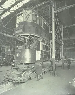 Men using a car lifting hoist at Charlton Central Repair Depot, London, 1932 Men using a car lifting hoist at Charlton Central Repair Depot, London, 1932