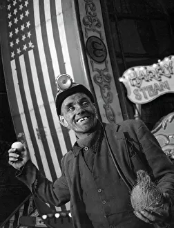 Miner at a fairground, Conisbrough, near Doncaster, South Yorkshire, 1955. Artist Miner at a fairground, Conisbrough, near Doncaster, South Yorkshire, 1955. Artist