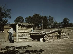 Log Cabin Gallery: Mr. Leatherman, homesteader, coming out of his dugout home, Pie Town, New Mexico, 1940