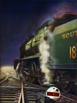 The Night Journey. A mixed-traffic locomotive of the Southern Railway at a cross-over The Night Journey. A mixed-traffic locomotive of the Southern Railway at a cross-over