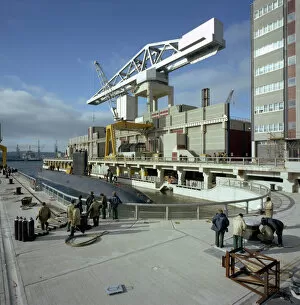 Cranes Gallery: A nuclear submarine berthing at Devonport docks, Plymouth, Devon, 1980