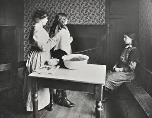 Head Louse Gallery: A nurse examines girls hair, Central Street Cleansing Station, London, 1914