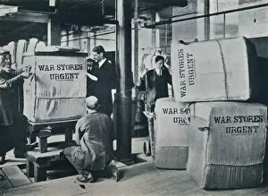 Urgent Gallery: Packing the bales of khaki for despatch to the Government, c1914