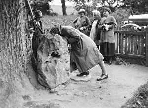 People visiting King Alfreds Blowing Stone, Kingston Lisle, near Uffington, Oxfordshire People visiting King Alfreds Blowing Stone, Kingston Lisle, near Uffington, Oxfordshire