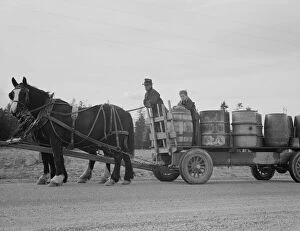 Possibly: Farmer and his boy hauling water for drinking and domest... Boundary County, Idaho, 1939