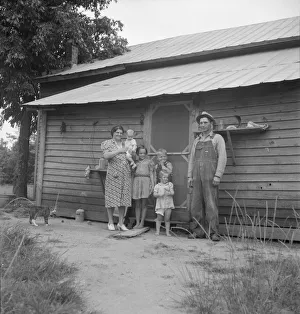 Possibly: Tobacco sharecropper with his oldest daughter, Person County, North Carolina, 1939. Creator: Dorothea Lange Possibly: Tobacco sharecropper with his oldest daughter, Person County, North Carolina, 1939. Creator: Dorothea Lange