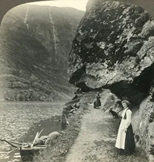 Where the road creeps under the jutting cliffs by the waters of the Nerofjord, Norway Where the road creeps under the jutting cliffs by the waters of the Nerofjord, Norway