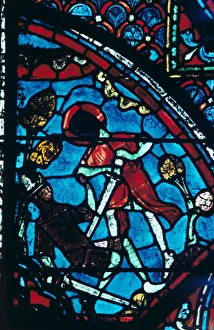 Roland pierces the giant Ferragut in the navel, stained glass, Chartres Cathedral Roland pierces the giant Ferragut in the navel, stained glass, Chartres Cathedral