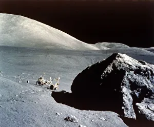 Apollo 17 Gallery: The Rover is dwarfed by a giant rock on the lunar surface, Apollo 17 mission, December 1972