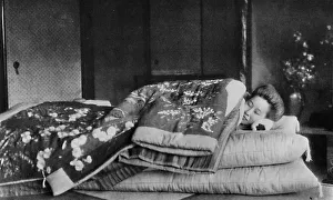 Saki, the housekeeper sleeps on a mattress with hard pillow under a quilted kimono, c1900 Saki, the housekeeper sleeps on a mattress with hard pillow under a quilted kimono, c1900