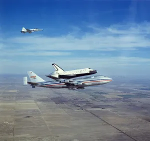 Space Shuttle Orbiter Columbia on Boeing 747 Shuttle Carrier, 1980s. Creator: NASA Space Shuttle Orbiter Columbia on Boeing 747 Shuttle Carrier, 1980s. Creator: NASA
