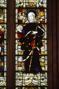 Prints of St. Hilda of Whitby holding an ammonite, West window, Hereford Cathedral, 20th century. Medieval stained glass window in Hereford Cathedral depicts Hilda of Whitby or Hild of Whitby (c) Herefordshire Prints: St Hilda of Whitby Print, 20th century