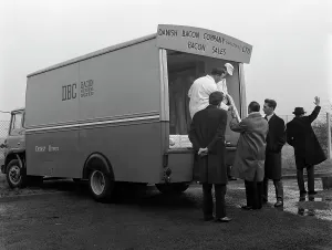 Traders buying bacon direct from a Danish Bacon wholesale van, Kilnhurst, South Yorkshire Traders buying bacon direct from a Danish Bacon wholesale van, Kilnhurst, South Yorkshire