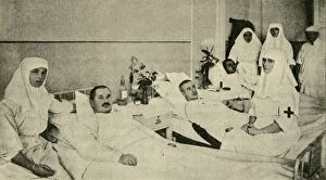 Tsarina Gallery: Tsarina Alexandra nursing wounded soldiers, 1914, (c1920). Creator: Unknown