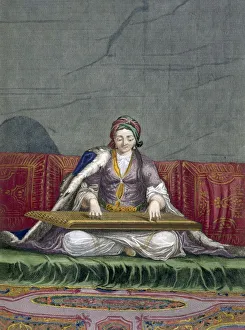 Turkish girl playing a keyboard plucking instrument, pub. 1707-08. Creator: Charles de Ferriol Turkish girl playing a keyboard plucking instrument, pub. 1707-08. Creator: Charles de Ferriol