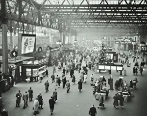 Prints of Waterloo Station, Lambeth, London, 1960. View of the concourse with bookstall and Christmas decorations. Passengers wait on benches, while others walk up and down Railway Prints: Heritage Images Print: Waterloo Station, London, 1960