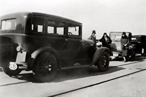 Images Dated 2nd August 2007: Women and parked cars, 1930