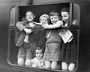 Children waving while being evacuated Children waving while being evacuated