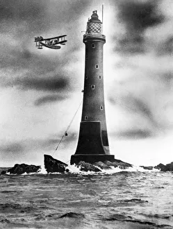 Eddystone lighthouse, with plane flying past Eddystone lighthouse, with plane flying past