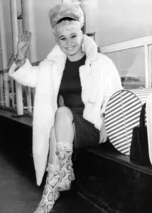 Prints of Actress Barbara Windsor at London Airport after touring America for 6 months in the play Oh What A Lovely War Fashion Prints: Barbara Windsor Print, London Airport 1965