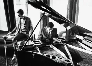 Prints of Muhammad Ali plays a tune on the piano to impress the media at a press conference which was held at the Piccadilly Hotel, London, after his world heavy-weight title fight with Henry Cooper 1966 Sport Prints: Muhammad Ali at the Piano Print