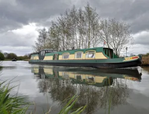 Narrowboats pass along the Bridgewater Canal Narrowboats pass along the Bridgewater Canal
