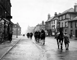 Racehorses pass through Newmarket on their way to the gallops in 1932 Racehorses pass through Newmarket on their way to the gallops in 1932