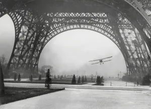 Prints of Lieut. Collot, flying through the base arch of the Eiffel Tower in Paris, France 1926 Paris Prints: Flying under the Eiffel Tower Print, 1926