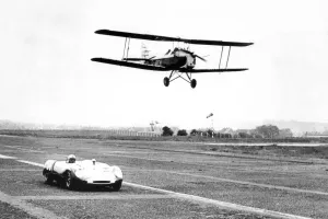 A Tiger Moth aircraft and a Lotus Ford 23B, racing at Usworth Aerodrome 1963 A Tiger Moth aircraft and a Lotus Ford 23B, racing at Usworth Aerodrome 1963