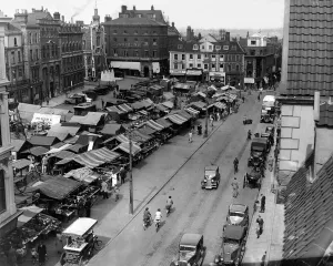Prints of Norwich Market place 1936 Shows Chamberlins Department store, Spalls, Dean and Palmers, Willberys, Corner Tea House Norwich Prints: Norwich Market Place 1936 Print