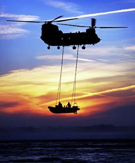 Inflatable Gallery: A Chinook helicopter and a Royal Marine rigid-inflatable boat (RIB), off Studland Bay, Dorset, UK