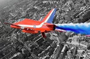 A Hawk T1A from the Red Arrows roars over London during a flypast for the Queen s