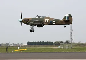 A Hurricane Mk IIC which forms part of the BBMF above RAF Conningsby A Hurricane Mk IIC which forms part of the BBMF above RAF Conningsby