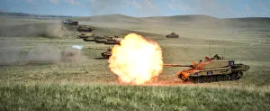 A line of Challenger 2s fire as part of the Royal Welsh Battle Group during Exercise A line of Challenger 2s fire as part of the Royal Welsh Battle Group during Exercise