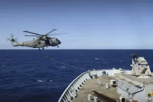 A Merlin Mk2 helicopter from 814 Naval Air Squadron conducting winching and communications A Merlin Mk2 helicopter from 814 Naval Air Squadron conducting winching and communications