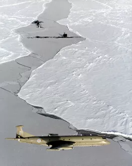 Navy Gallery: An RAF Nimrod MR2 on patrol in the skies over the ice, it is shown with two submarines