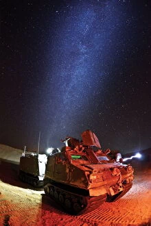 Tracked Gallery: Royal Marines Viking amphibious vehicle under the Mojave Desert night sky