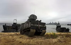 Royal Navy Marines taking part in a simulated beach landing using Land Craft