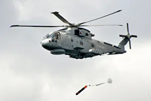 Royal Navy Merlin Helicopter Launching a Training Torpedo Royal Navy Merlin Helicopter Launching a Training Torpedo