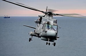 Images Dated 4th February 2012: Royal Navy Merlin Helicopter Takes Off from RFA Argus