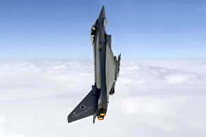 A Typhoon F2 multi-role jet fighter of 11 Squadron, Royal Air Force, performs a vertical A Typhoon F2 multi-role jet fighter of 11 Squadron, Royal Air Force, performs a vertical