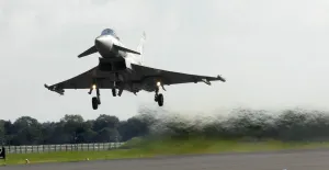 A Typhoon is shown taking off to take part in an Air Display at RAF Coningsby A Typhoon is shown taking off to take part in an Air Display at RAF Coningsby