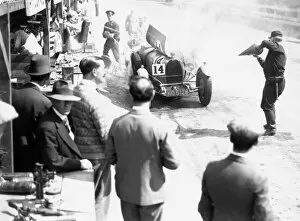 Images Dated 2nd March 2005: 1929 Irish Grand Prix. Car number 14, catches fire in the pit lane, action