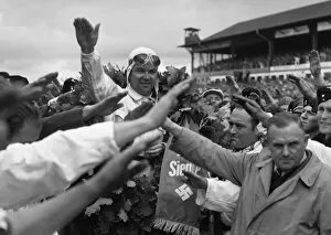 Images Dated 11th September 2012: 1939 German Grand Prix - Rudolf Caracciola: Rudolf Caracciola salutes the Fuhrer after his race win