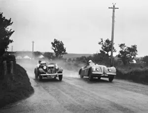 Images Dated 28th June 2010: 1950 Tourist Trophy: Stirling Moss, 1st position, passes T. Flack, 23rd position, action