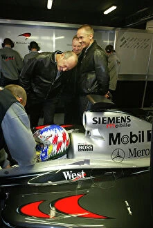 Images Dated 19th January 2002: 2002 West McLaren Mercedes Launch Ron Dennis and Martin Whitmarsh watch Alex Wurz in the new