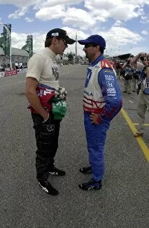 Images Dated 6th July 2002: Adrian Fernandez and Michael Andretti compare notes before qualifying for the Molson Indy Toronto