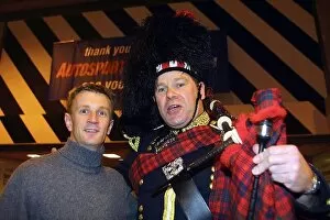Images Dated 13th January 2002: Autosport International Show: Allan McNish Toyota with his bagpipe player